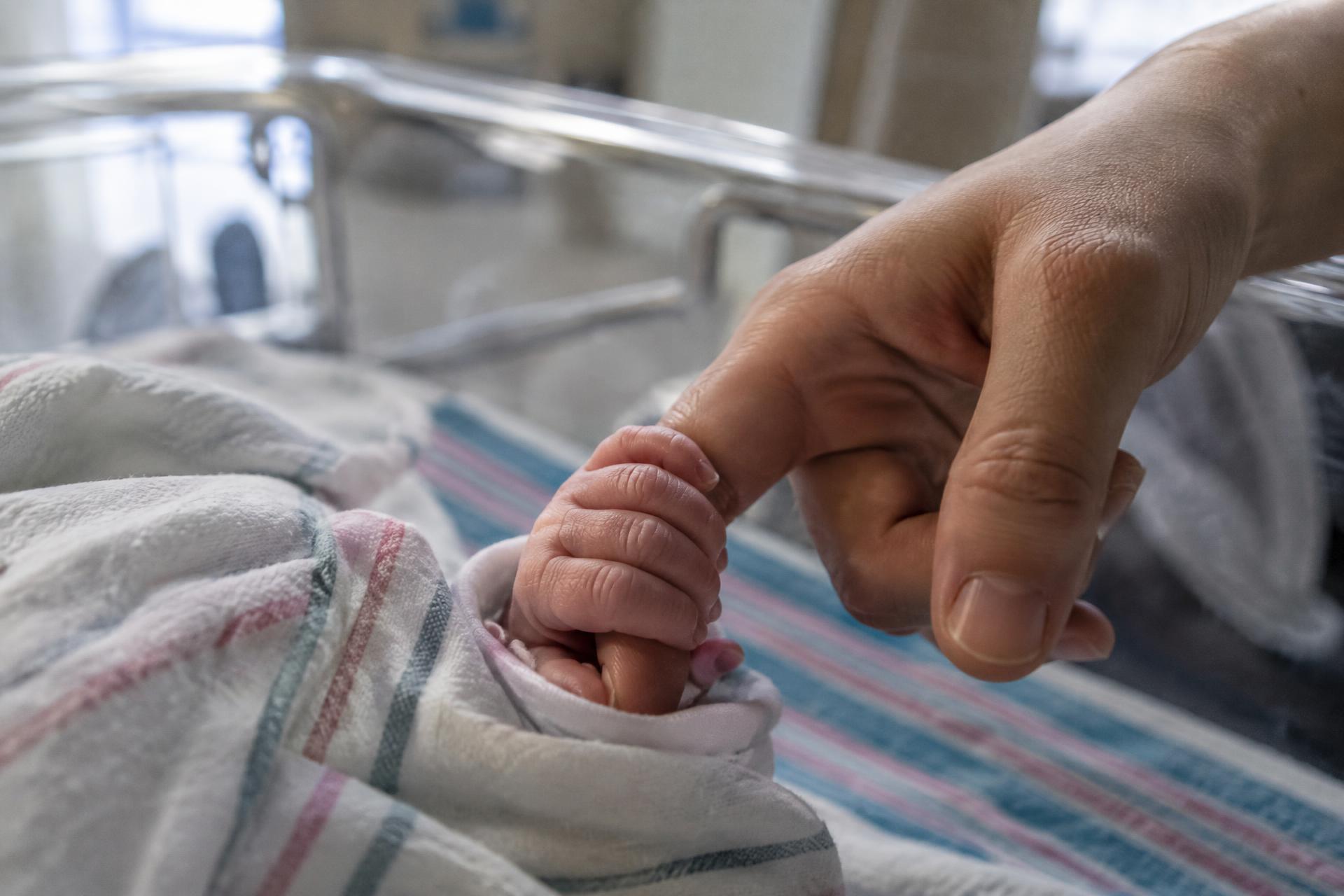 A newborn receiving care moments after birth